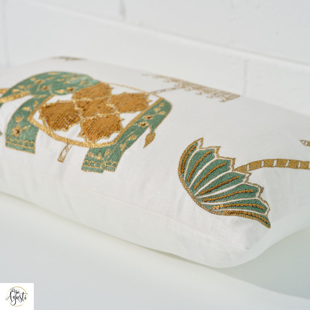 Pooram cushion cover styled on a bed