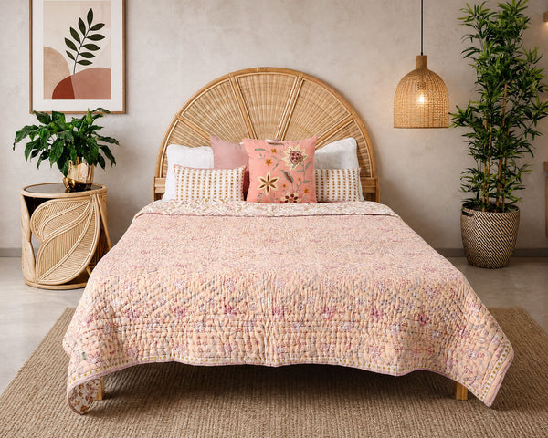 Aranyani hand block-printed quilt on a styled bed