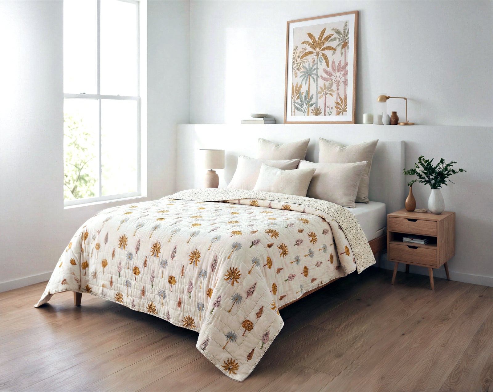 Bedroom with floral bedding and decor, including a nightstand and framed artwork.