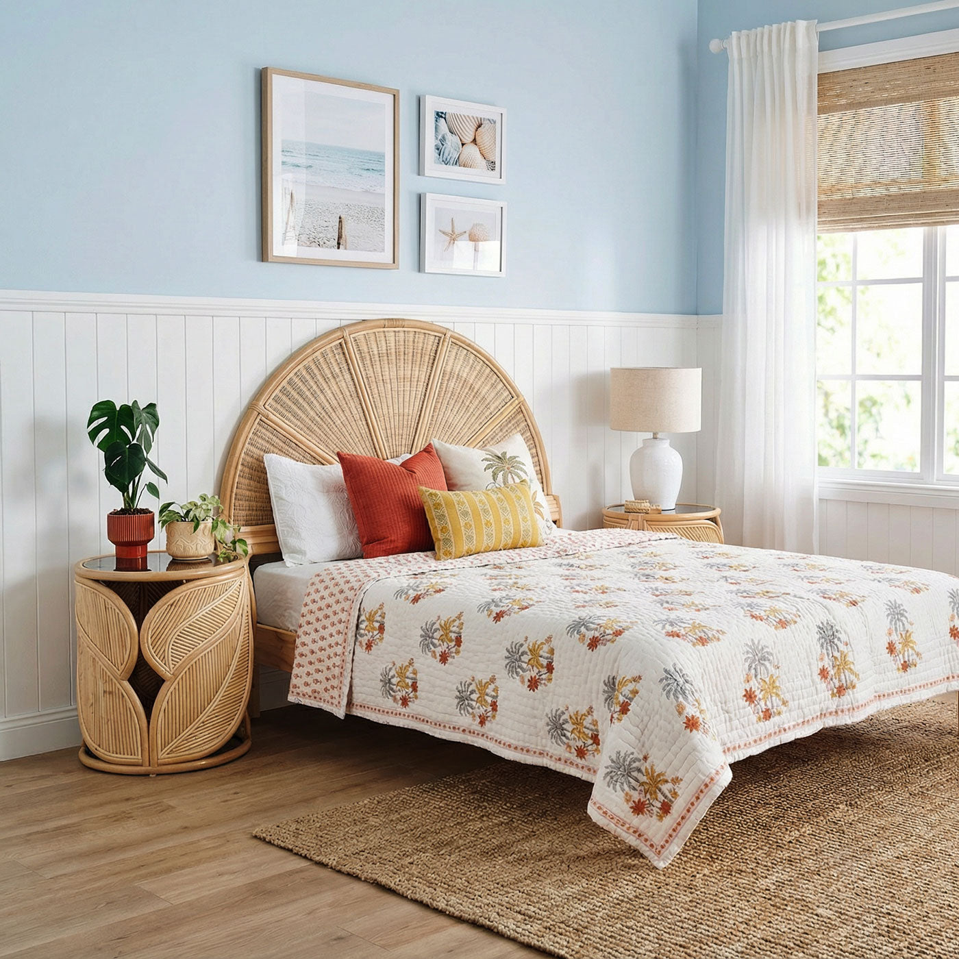 Bedroom with a wicker headboard, floral bedding, and decorative pillows.